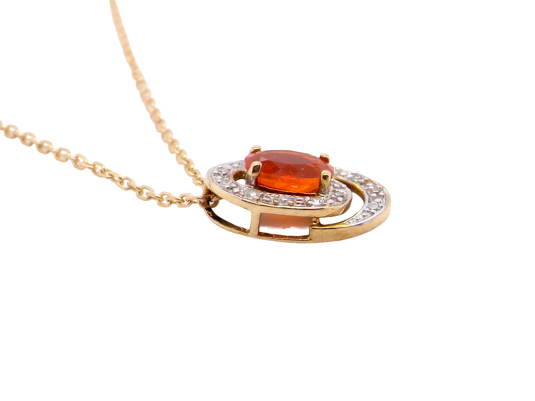 side A very pretty pendant set with a fireglow orange Fire Opal.&nbsp; Measures 6x4mm (0.50 carats).
