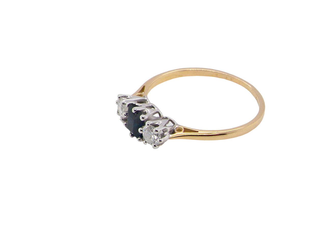 side A vintage 1950s three stone ring. Centre stone an ink black blue sapphire, measures 4x4mm (est 0.30 carats).

