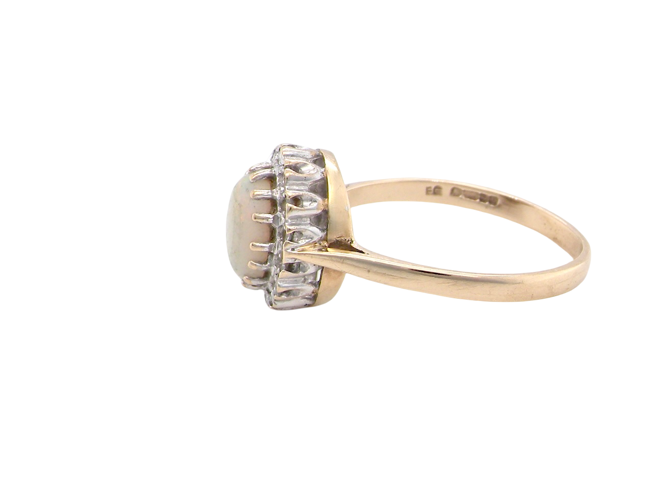 side A vintage cluster ring set with an oval cabouchon cut opa