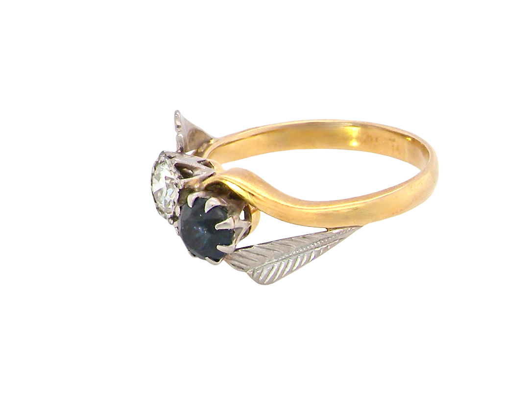 side A vintage crossover ring. Set with a round sapphire 5mm diameter, black blue colour.

