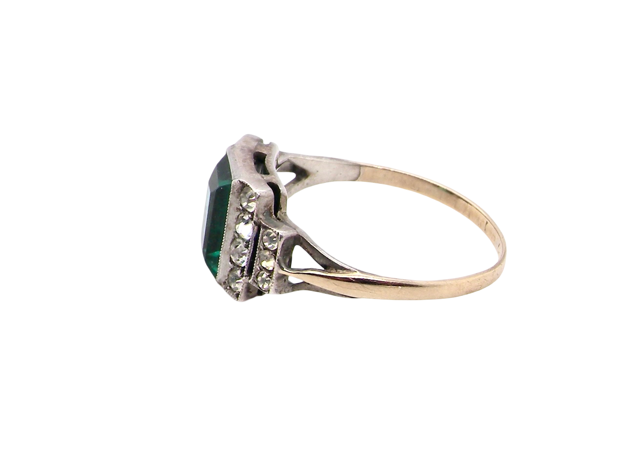 side A vintage early 20th century dress ring. The centre stone a vibrant crystal clear green paste stone, 8x6mm.