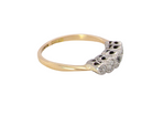 side A vintage ring containing five old brilliant cut white diamonds. Centre 3mm, each side 2.2mm, at each end a 1.8mm diamond. Total diamond content estimated at 0.25 carats. All illusion set in platinum
