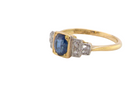 side A vintage ring that features to the centre a substantial sapphire and to each side set in platinum three small diamonds.