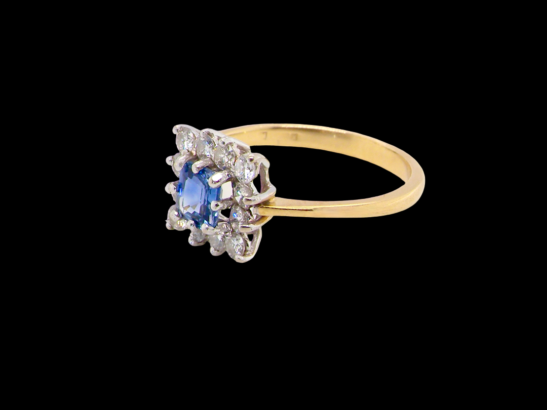 side A vintage square cluster ring. Features to the centre a square sapphire 5x5mm (est 0.50 carats) mid blue- cornflower hue.&nbsp;

