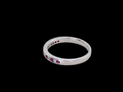 side A white gold half hoop eternity ring. Set with seven round rubies and six brilliant cut white diamonds