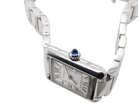 side A womans stainless steel Cartier Tank Must wrist watch. Model number WSTA0051.

Silver coloured dial with Roman Numerals. Blue steeled hands. Case measures 29.5x22mm, case thickness 6.6mm. Quartz movement, synthetic sapphire button.
