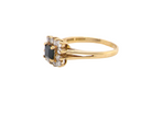 An 18 carat Gold Sapphire and Diamond Cluster Ring (Hallmarked 1997)