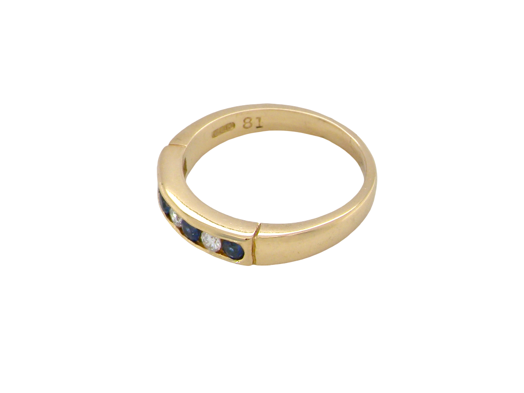 side An 18 carat gold half hoop eternity ring.

Features four round sapphires , each 2.4mm,