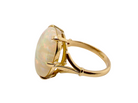 side An 18 carat yellow gold* dress ring set with a large oval opal gemstone.