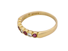 side An 18 carat yellow gold half hoop eternity ring. Set with four rubies, 3mm each.&nbsp;

Set with alternate diamonds, each 3mm (0.10 carats each) colour i-j, clarity Si.
