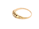 Gold ring with a unique design on a white background