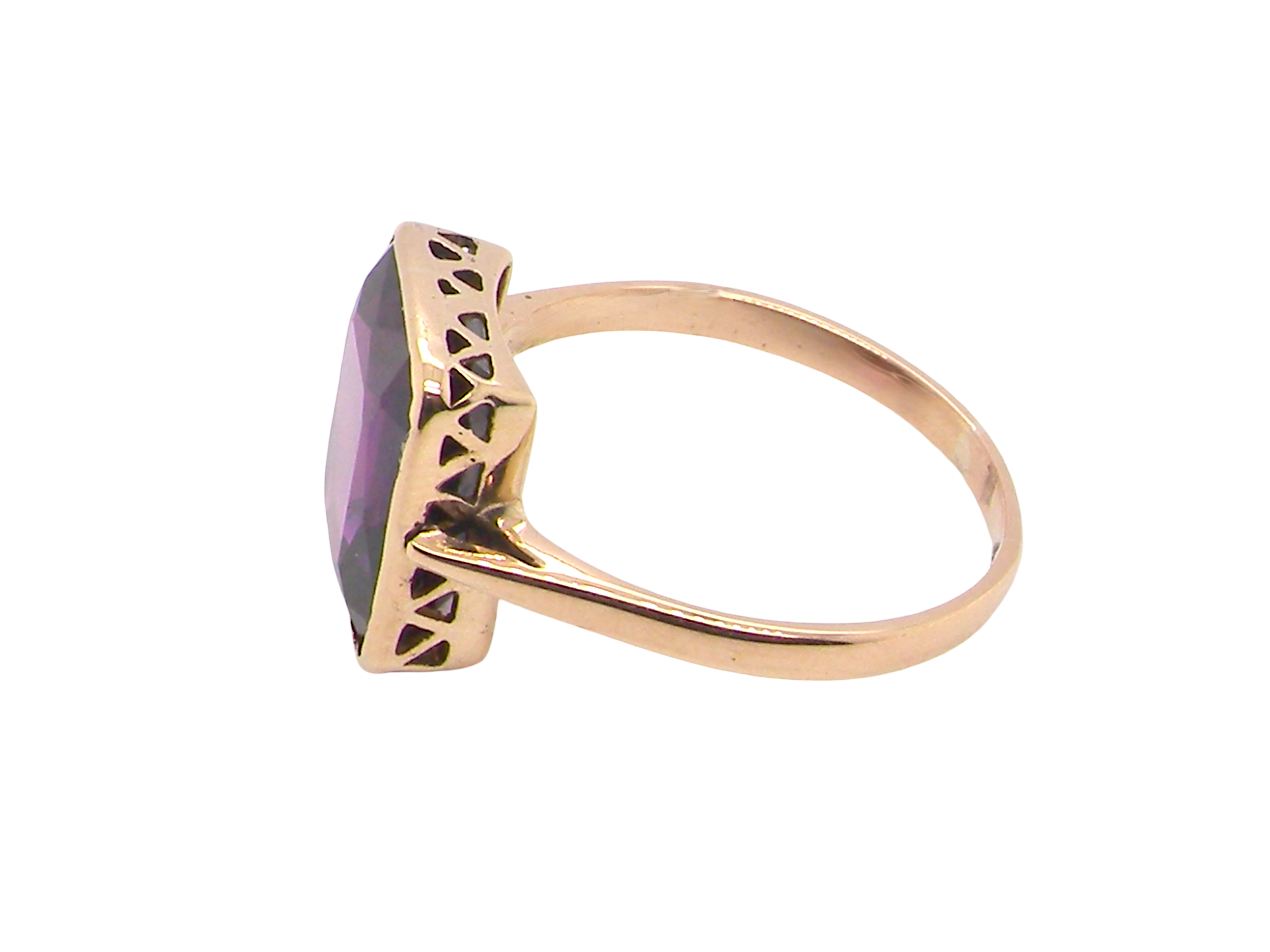 side An antique dress ring that features a rectangular cut amethyst. Very dark purple, measures 12x10mm. Rim setting.
