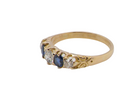 An antique ring from the early years of the 20th century. Centre stone 5mm diameter (0.50 carats) Colour H-j, clarity Si. Each side&nbsp; a mid colour blue sapphire 4mm diameter.
side view