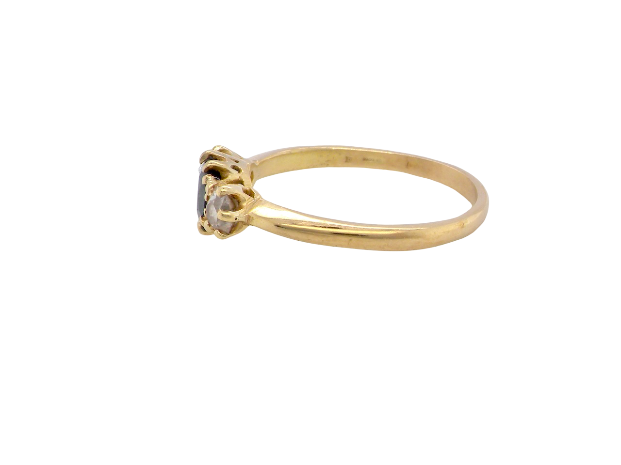 side An early 20th-century trilogy ring set with a mid to dark cornflower blue central sapphire, 