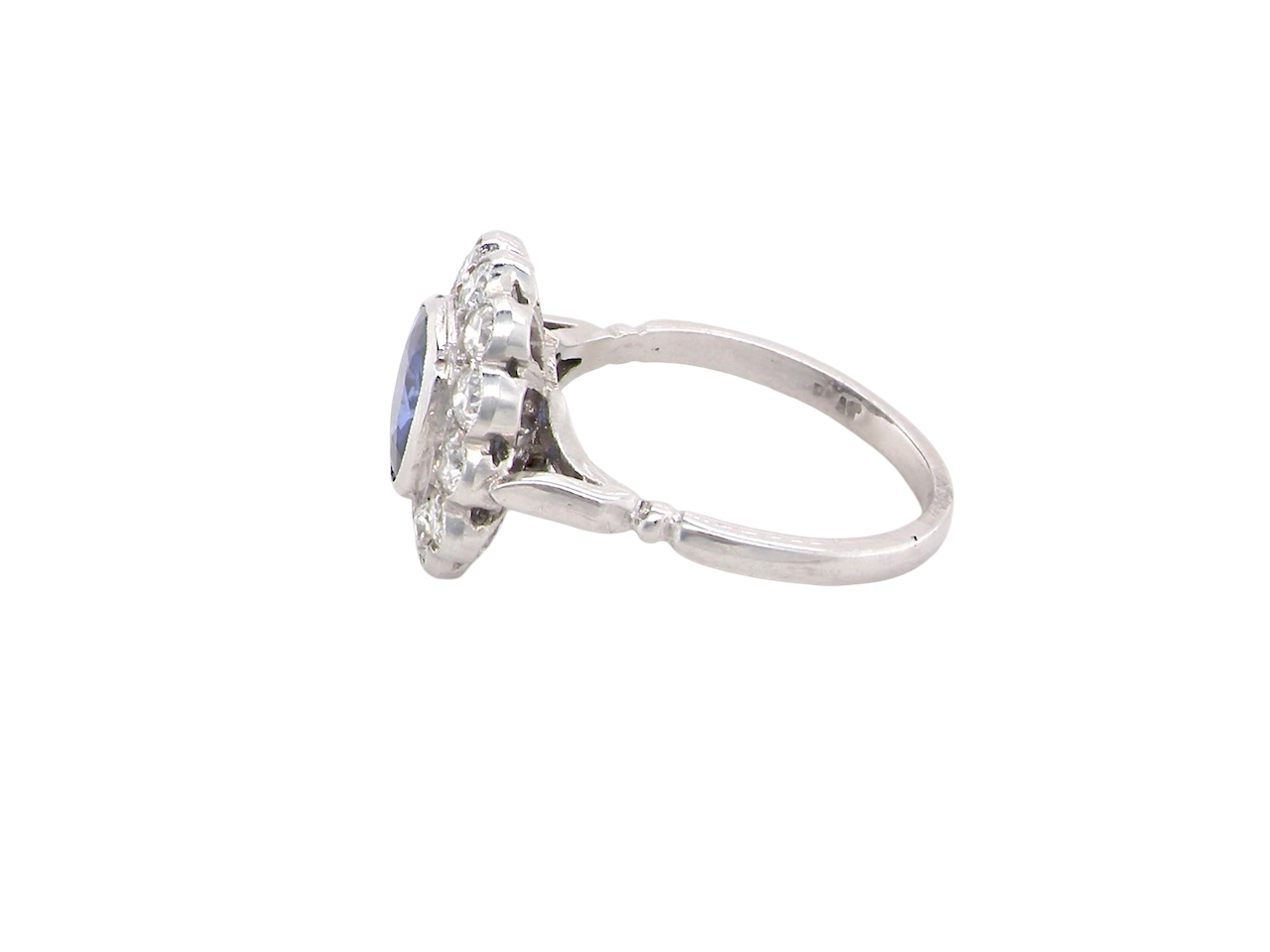 side An elegant and timeless cluster ring, centrally set with a beautiful mid to deep blue cushion-cut sapphire, measuring approximately 8 x 8mm (estimated 2.00 carats). 