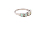 An elegant opal and diamond half hoop ring, featuring five oval opals with lively play of colour. Each opal measures 5 x 3mm, with an estimated total opal weight of approximately 0.75 carats, all claw set to maximise light and colour.