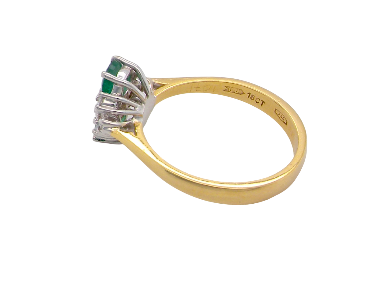 Gold ring with gemstones on a white background