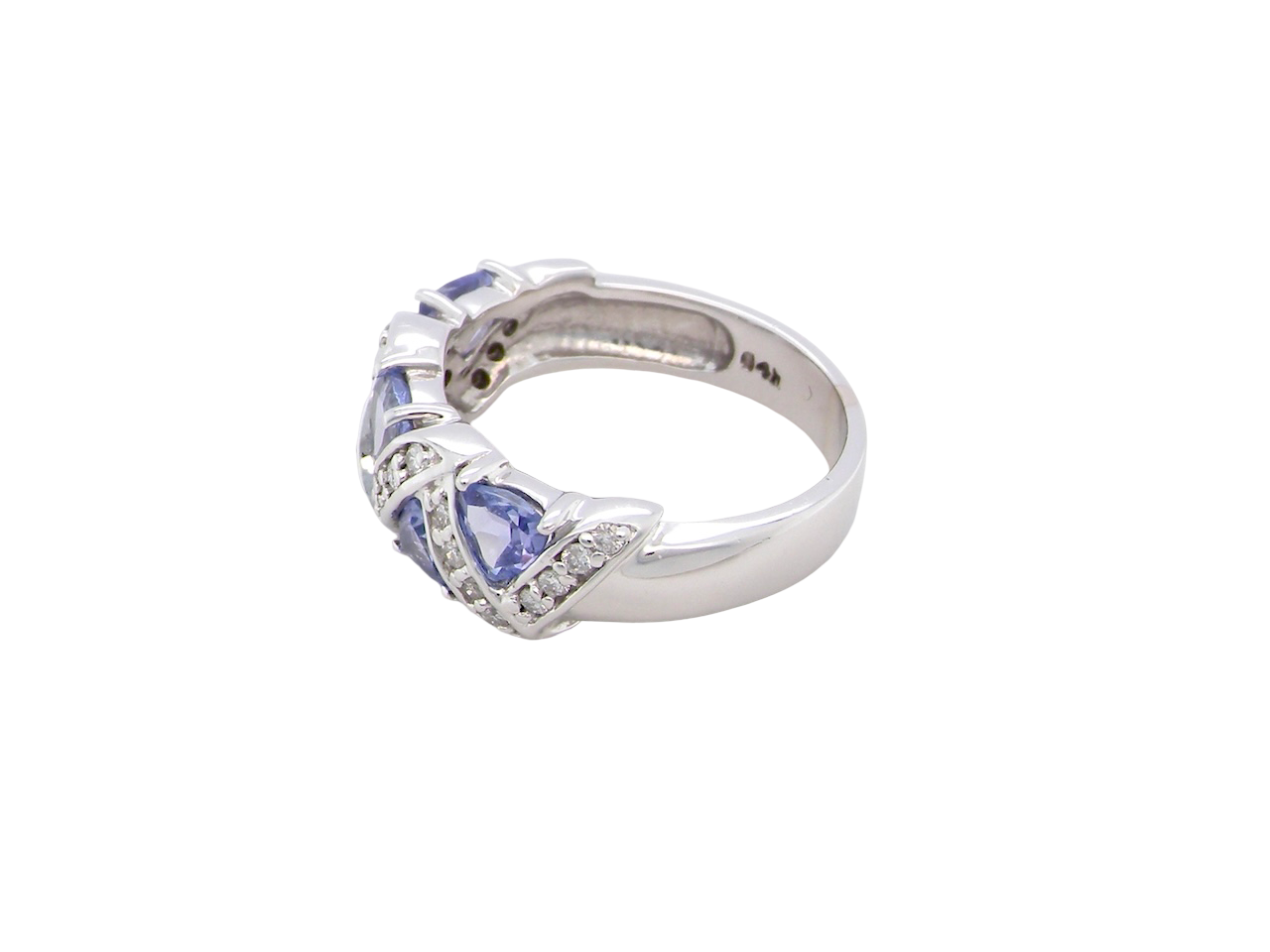 side beautiful and eye-catching dress ring set in 14ct white gold, featuring five triangular tanzanite gemstones