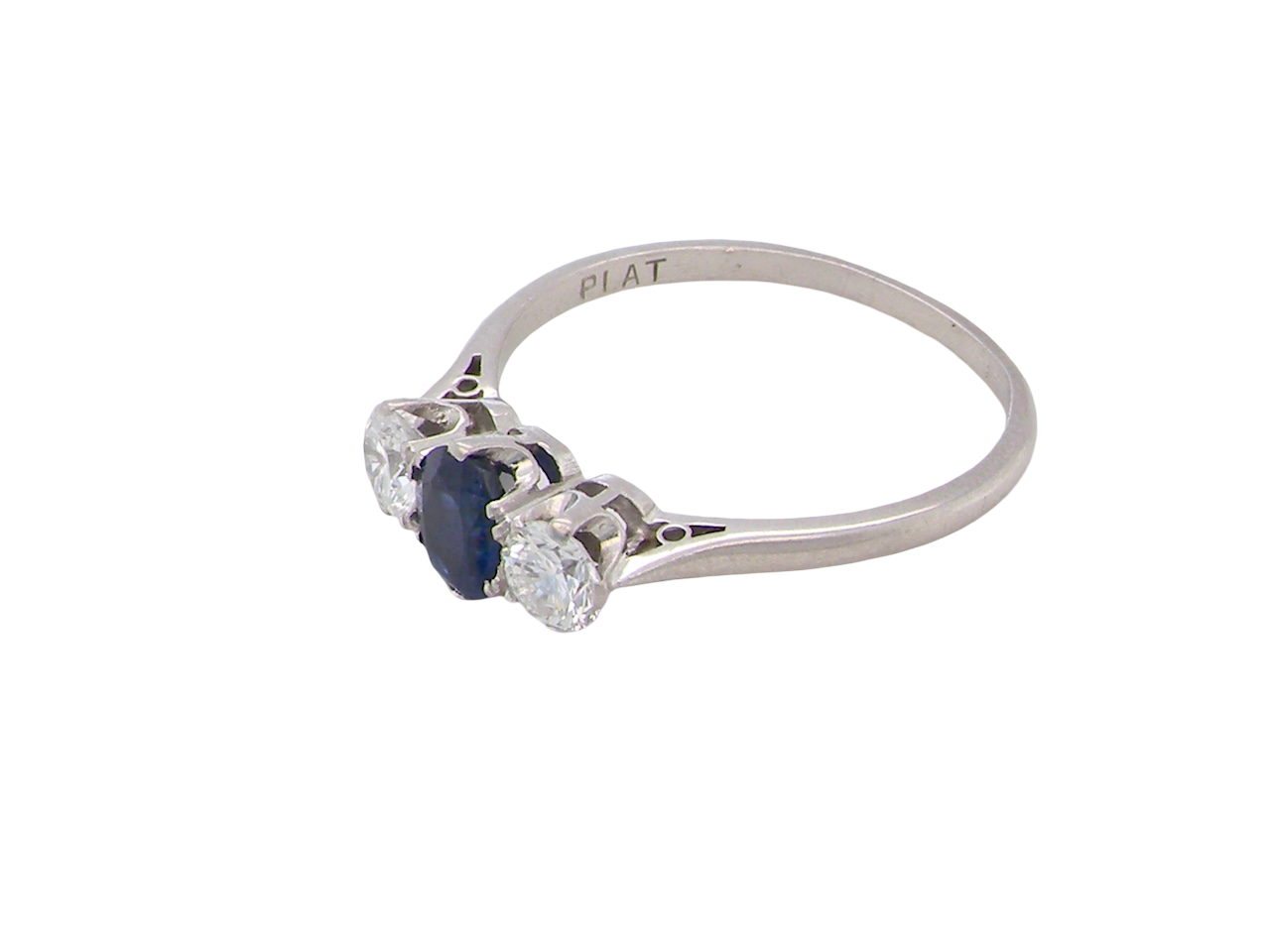 side  classic trilogy ring set with an exquisite oval cut sapphire centre stone, hues of deep&nbsp; blue colour and measuring 6x4.2mm (est approx 0.50 carats) 