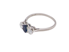 side  classic trilogy ring set with an exquisite oval cut sapphire centre stone, hues of deep&nbsp; blue colour and measuring 6x4.2mm (est approx 0.50 carats) 