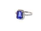 side  cluster ring featuring a 4A quality Tanzanite as its centre stone. 