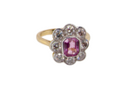 side  cluster ring featuring a beautiful cushion-cut pink sapphire 