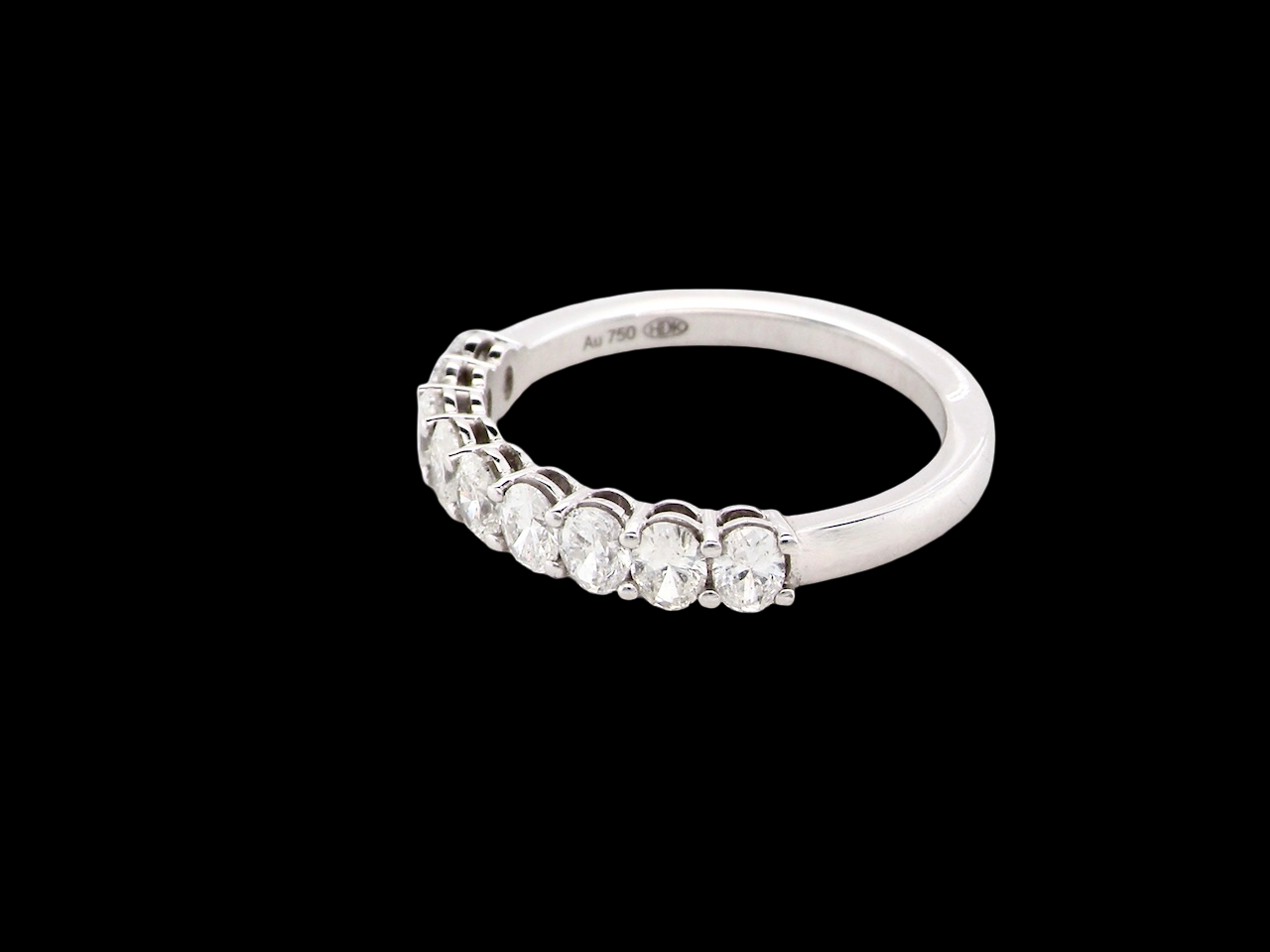 side gorgeous half-hoop eternity ring set with nine oval brilliant-cut white diamonds.