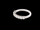 side gorgeous half-hoop eternity ring set with nine oval brilliant-cut white diamonds.