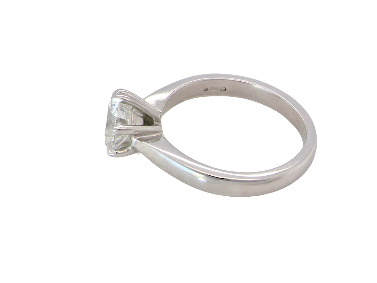 side  iconic solitaire ring. Features an impressive brilliant cut white diamond. 