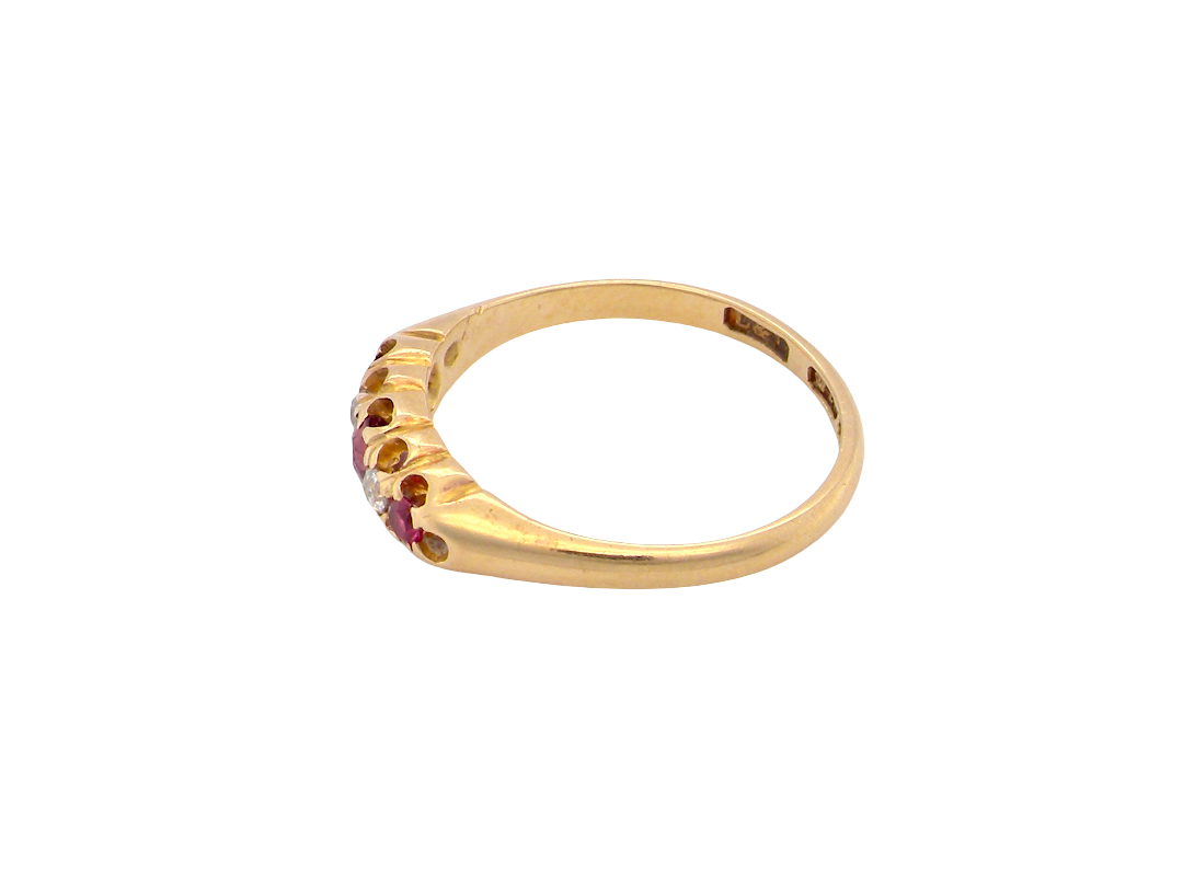 side A vintage 18 carat gold three stone ring. Set with brilliant cut white diamonds, cente 3mm, each side a 2.4mm diamond (total est 0.20 carats) Colour I-j, clarity Si.&nbsp;

