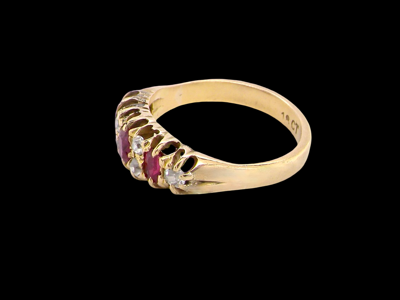 side typical boat shaped ring from the late Victorian era, probably 1890-1900. This ring is set with three oval cut rubies,