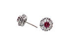side view A fine pair of cluster earrings. Features to the centre a round 4.6mm pink sapphire (est 0.38 carats) with a good deep colour hue.