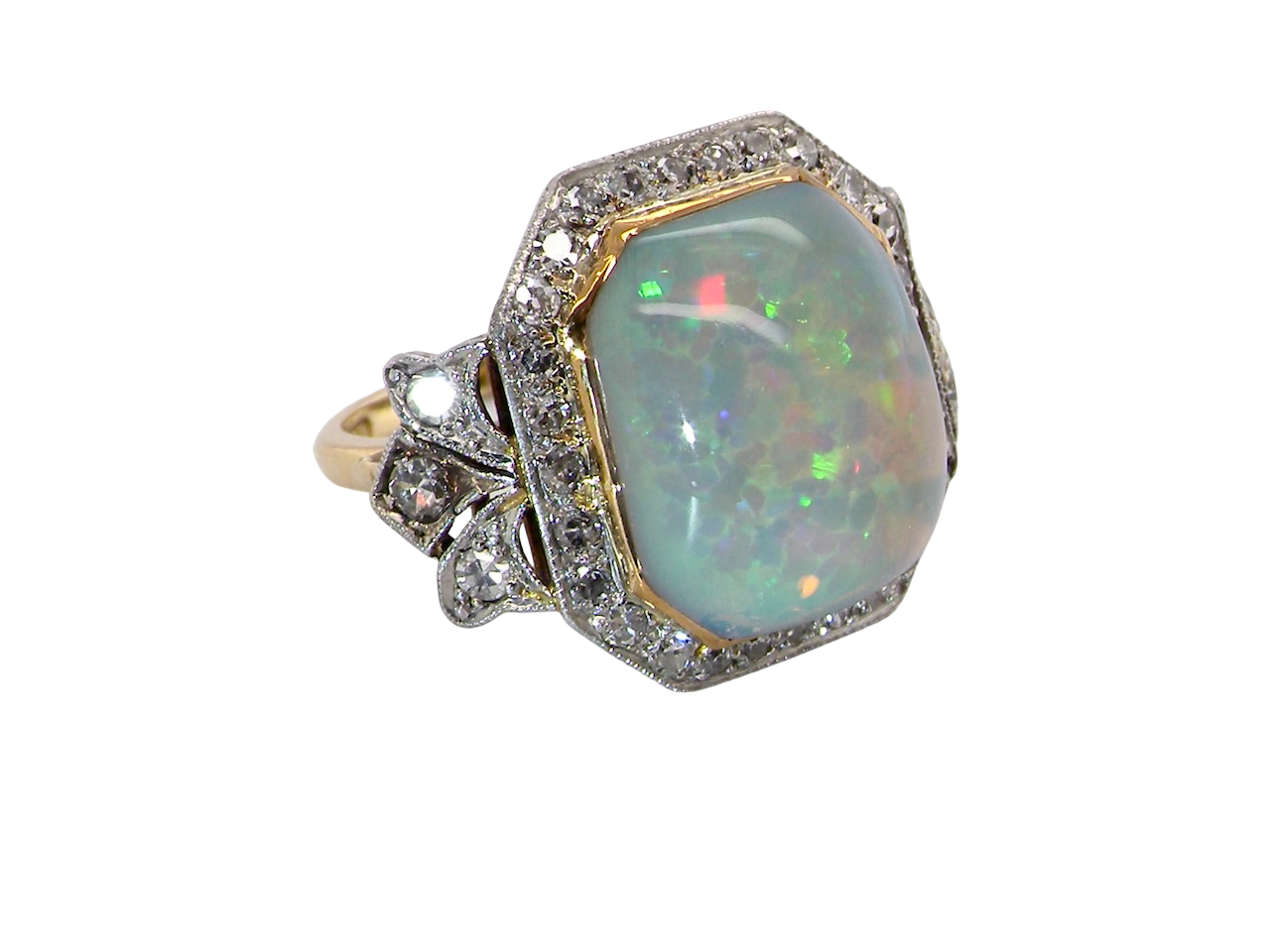 side view cabouchon cut opal shown is cushion shaped, measures 15x13 (5.78 carats) displaying a mass of vibrant colours, from flashes of fireglow orange, luminous greens, and lavender purples.
