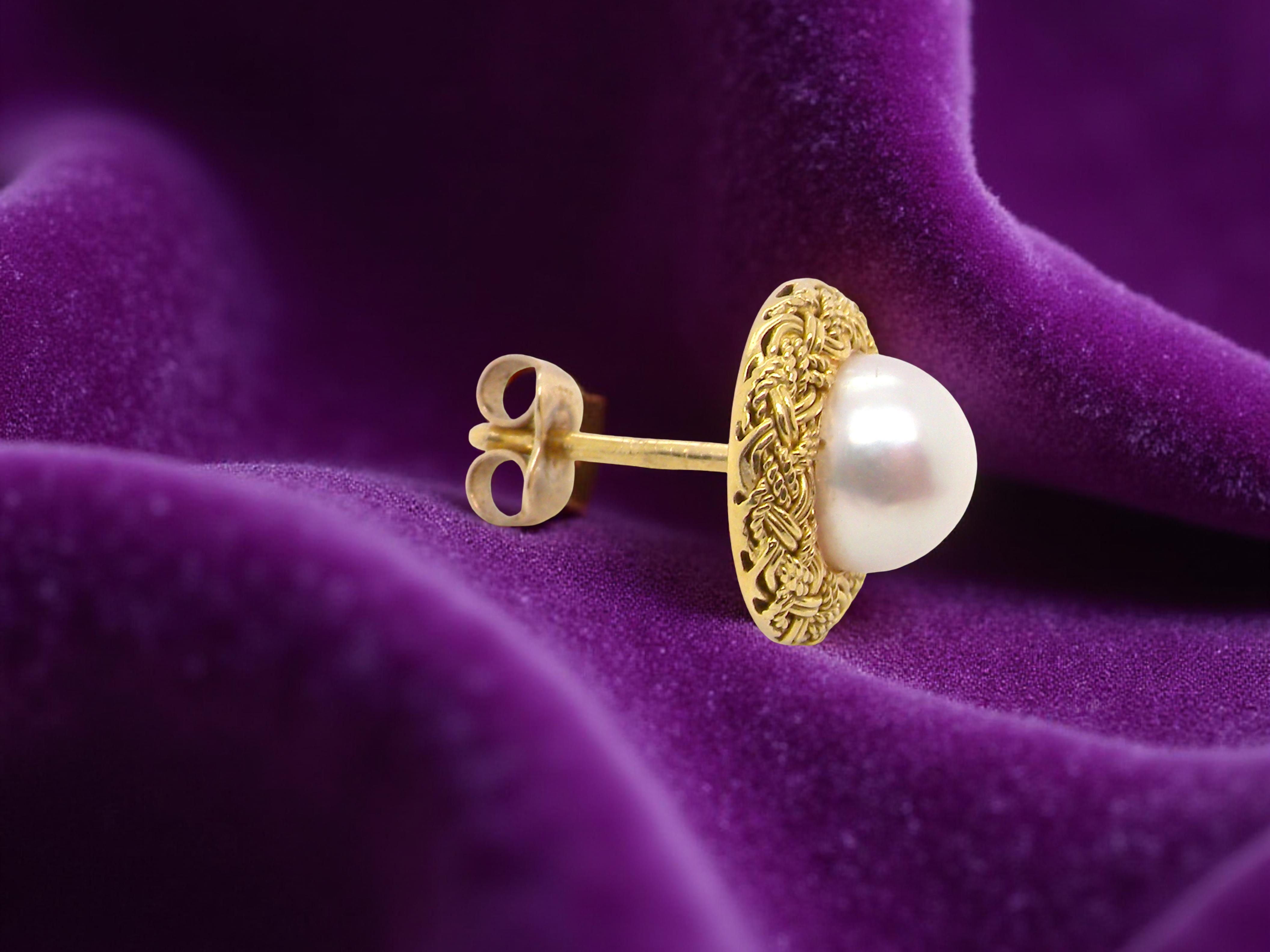 single A lovely pair of elegant earrings, each set with a 7.7 mm cultured pearl.