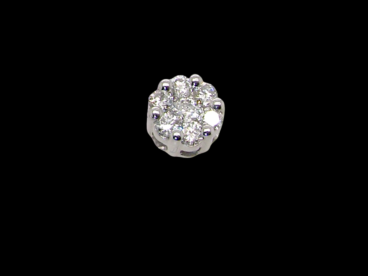 single A pair of 9 carat white gold diamond stud earrings.&nbsp;

Set as a cluster 
