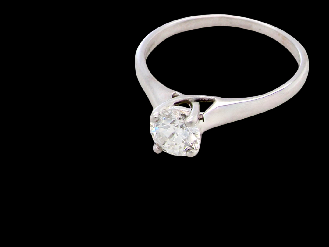  solitaire ring containing a fine modern brilliant cut white diamond. Measures 5.4mm (.53 carats)

Colour G-h, clarity Si. Modern feature under setting, 