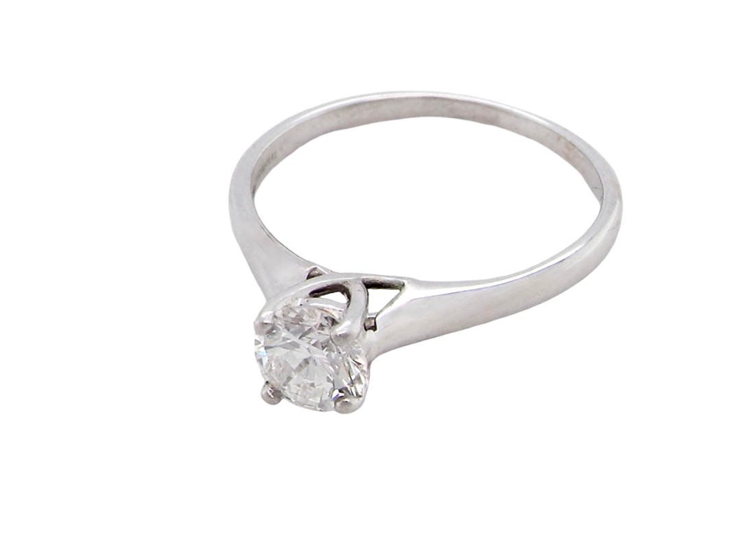 solitaire ring containing a fine modern brilliant cut white diamond. Measures 5.4mm (.53 carats)

Colour G-h, clarity Si. Modern feature under setting, depth 6.8mm, weight 2.6grams.
  above