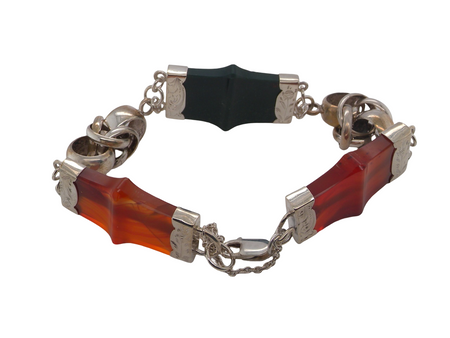 sterling silver bracelet of Scottish origin, featuring a panel of bold, shaped links. Each panel link measures approximately 35 × 20 mm.