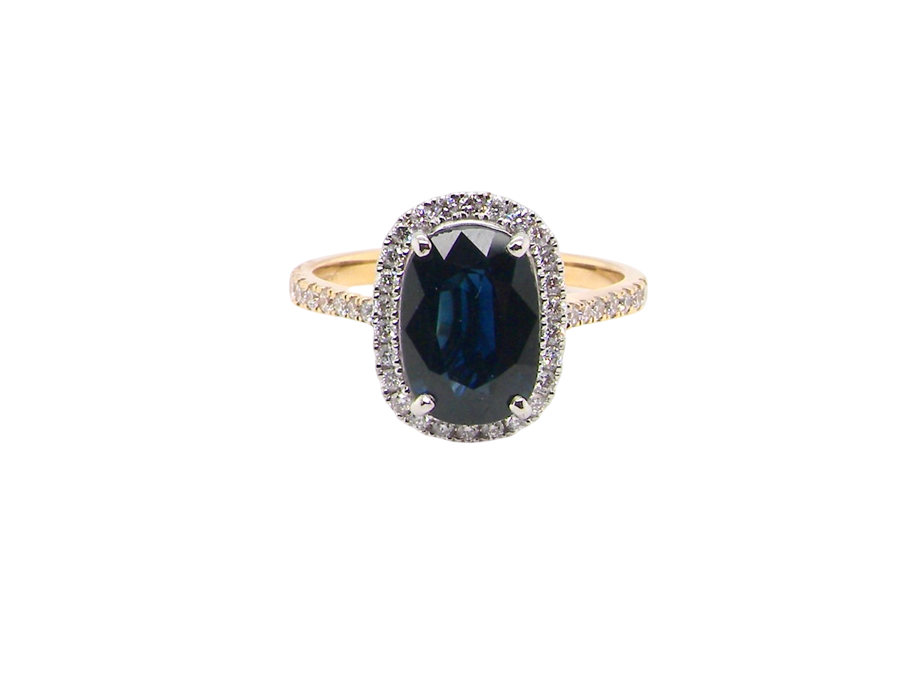 striking cluster ring featuring a captivating&nbsp;ink-black blue sapphire,