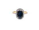 striking cluster ring featuring a captivating&nbsp;ink-black blue sapphire,
