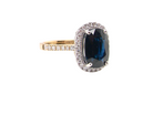 striking cluster ring featuring a &nbsp;ink-black blue sapphire,