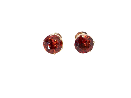  stud earrings. Each one is set with a round garnet, 8mm diameter