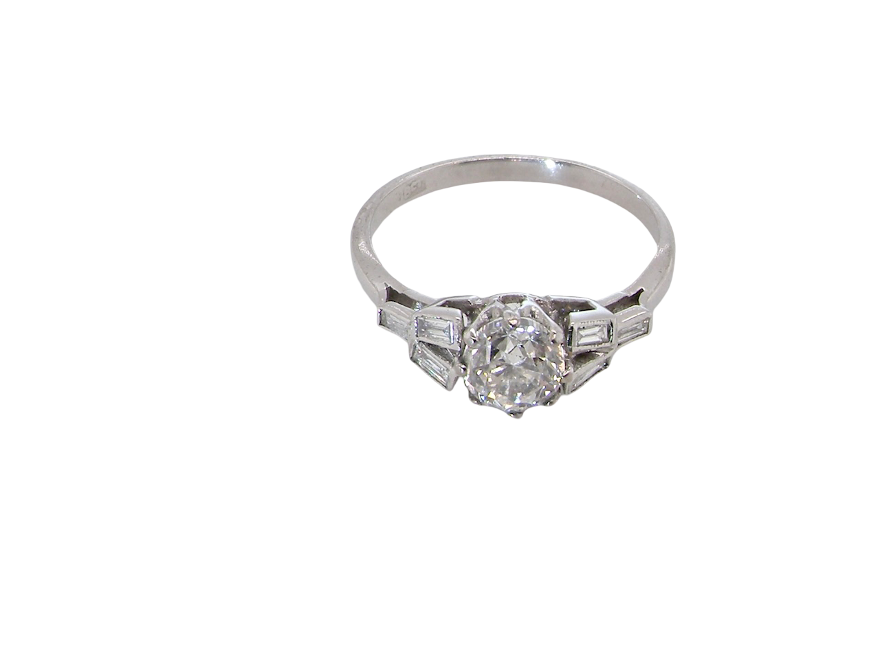 A beautifully proportioned Art Deco solitaire ring showcasing a sparkling old brilliant cut white diamond