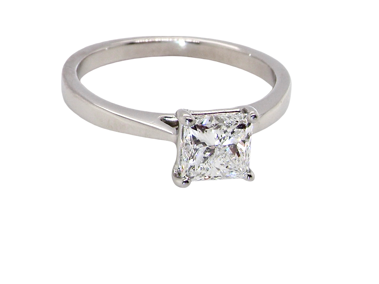 top A fine solitaire ring featuring a square cut diamond of excellent quality.

Superb colour grade of E, excellent clarity- graded VVS2*. Stone measures 5x5x3.68, confirmed as 0.83 carats.
