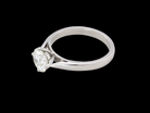 top An impressive platinum solitaire ring set with a modern brilliant-cut white diamond.