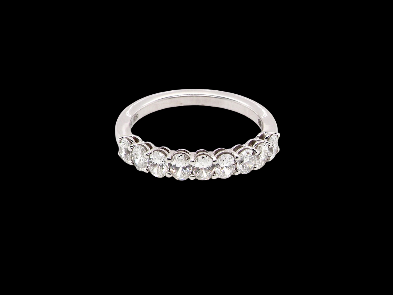 top gorgeous half-hoop eternity ring set with nine oval brilliant-cut white diamonds.