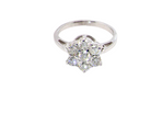 top view A beautiful vintage diamond cluster ring, elegantly set with seven brilliant-cut white diamonds in a timeless floral cluster design.
