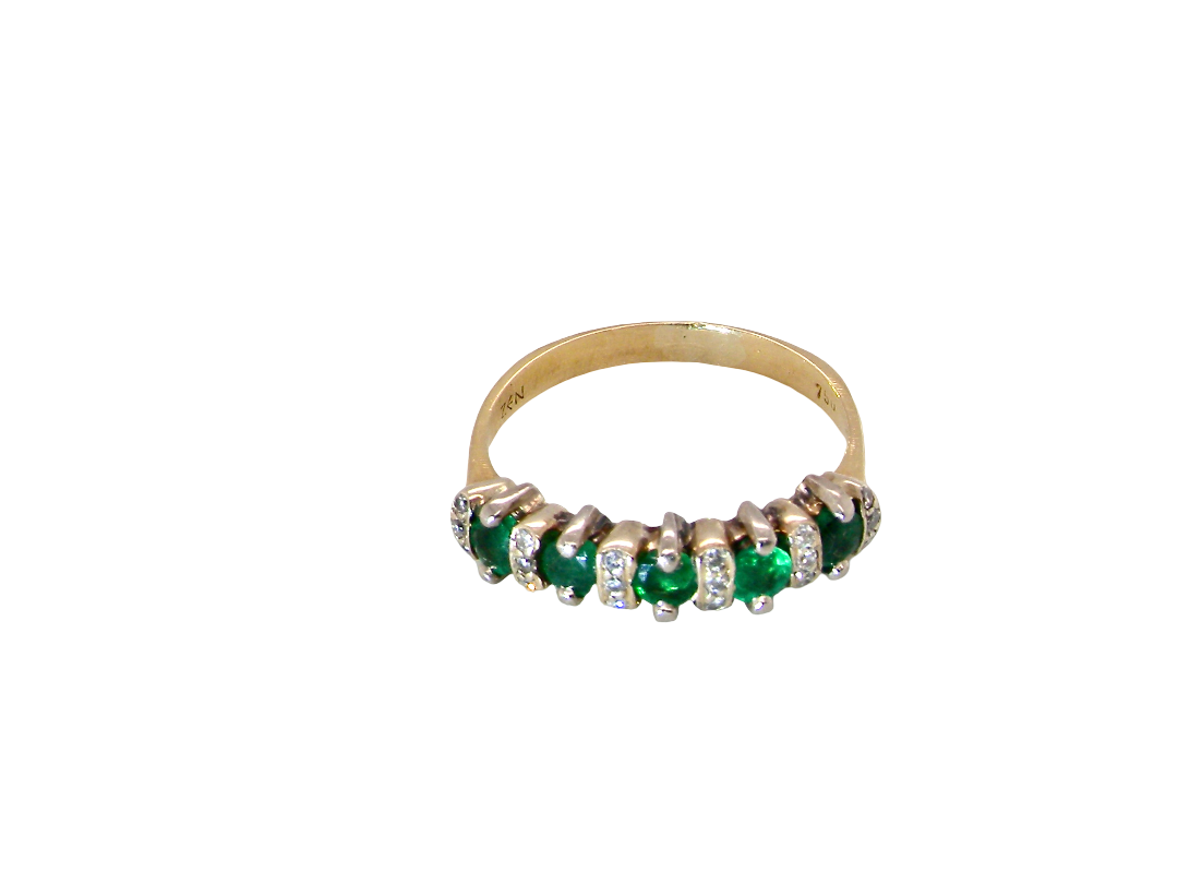 top view A half hoop ring, stamped 750 (testing as 18 carat gold)&nbsp;

Set with alternate gemstones, five bright green emeralds