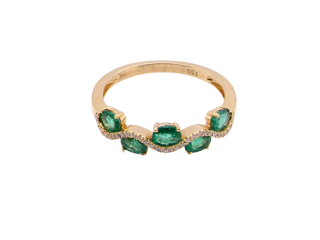 top view A half hoop ring with a very attractive line of oval cut emeralds, each 4x3mm, a lovely deep grass green hue, and with very good clarity too.
