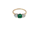 top view A vintage trilogy ring. Centre stone a step cut emerald, 6.5x5.5mm (est .75 carats). The emerald is dark green. 